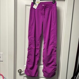 Under Armour Purple Track Pants with Elastic Waist and Moisture-Wicking Fabric